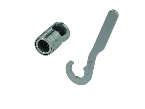 Werkzeugset von TECE mit einem Handkalibrierer und einem Hakenschlüssel. Beide Teile sind aus Metall und haben eine funktionale, robuste Form.